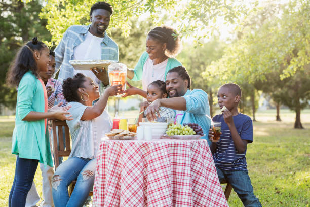 istock Large African-American family having backyard cookout 984459478