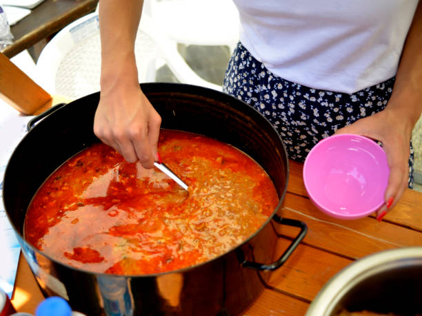 istock Serving a nice and spicy Fish soup 984460056