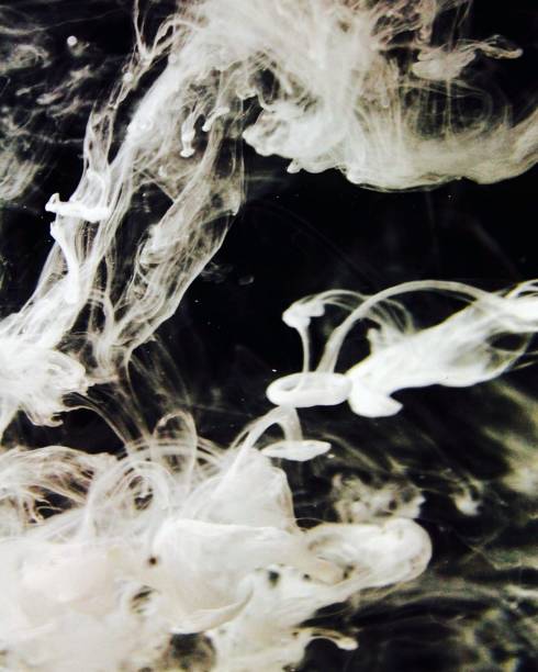 istock Clouds of smoke on a black background 984463420