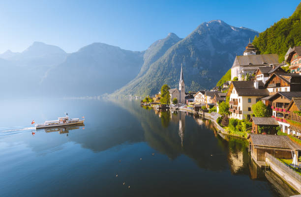 istock Classic view of Hallstatt with ship in summer, Austria 984475570