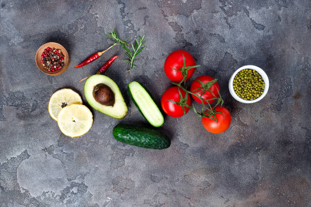 istock Fresh vegetables ingredients for salad with mung beans on stone background, top view, 984487566