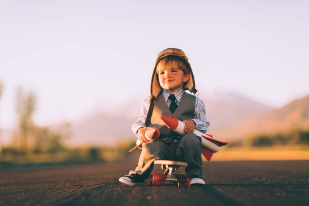 istock Young Business Boy On Skateboard with Rockets 984498480