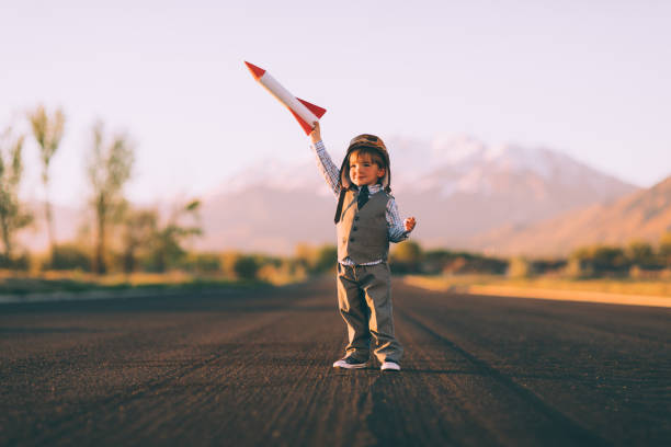 istock Young Boy Business Entrepreneur is Flying a Rocket 984498586