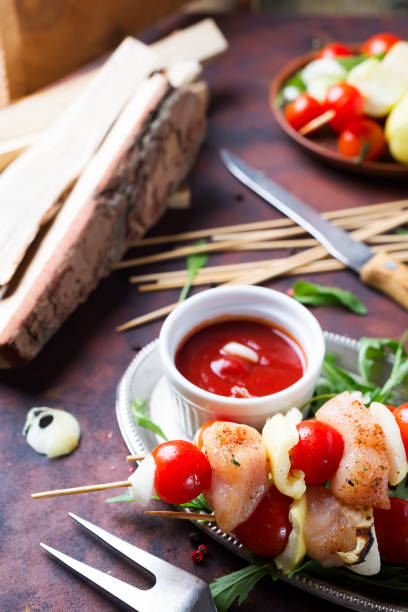istock Skewer with chicken meat, tomato and bell pepper 984498918