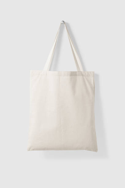 Blank Tote Canvas Bag Mockup on light grey background. Blank Tote Canvas Bag Mockup on light grey background. High resolution. tote bag mock up stock pictures, royalty-free photos & images