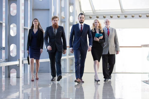 istock Business team walking in glass building 984507636