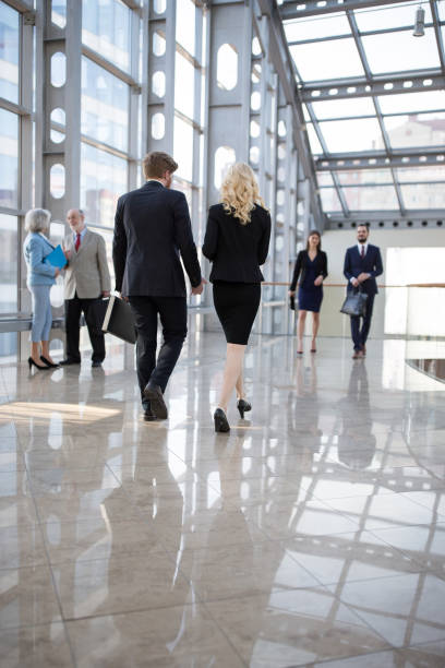 istock Business people walking in office corridor 984507638