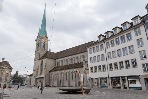 Fraumünster Kirche on Münsterhof in Zurich, Switzerland.  People are visible in square.