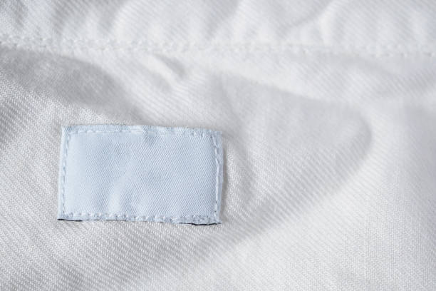 istock White blank laundry care clothes label on cotton shirt 984519896