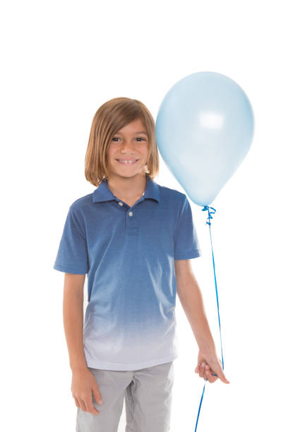 istock Young Boy Holding  Blue Balloon 984541692