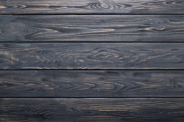 istock Dark gray old rustic wood planks texture or background. 984548448
