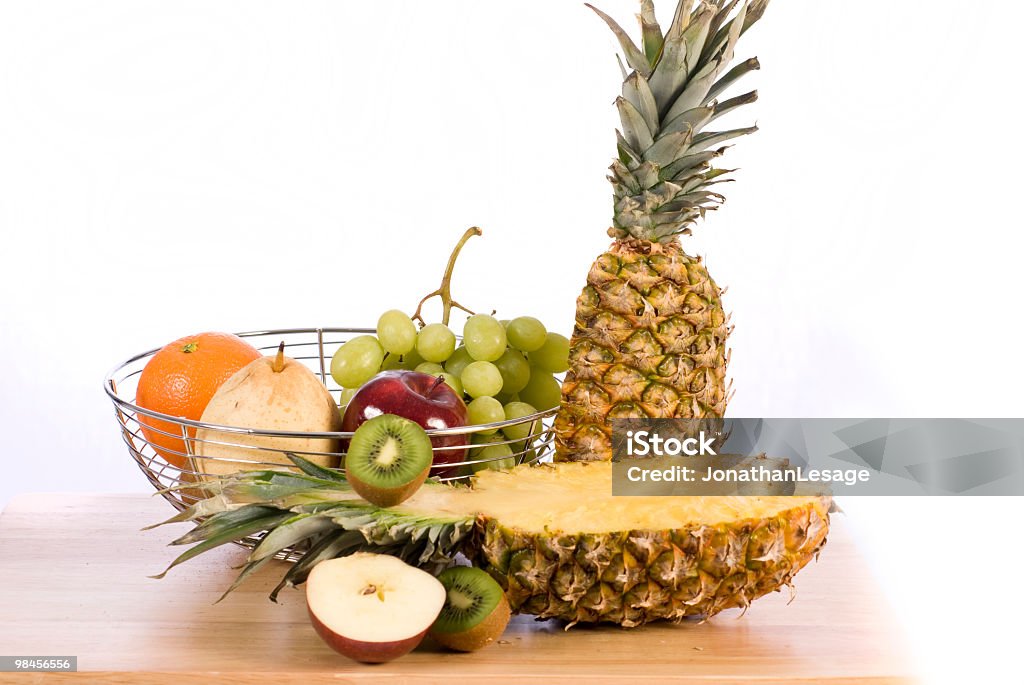 fruit basket pineapple, grape, orange, pear, kiwi, panier  Apple - Fruit Stock Photo