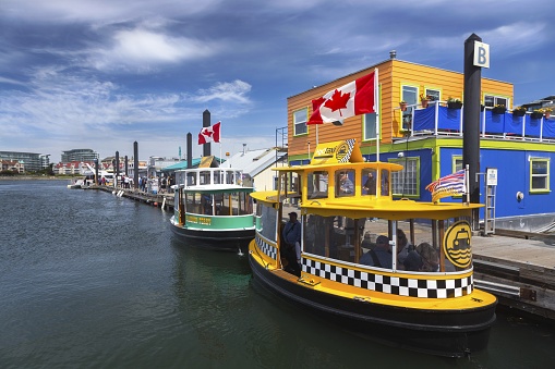 Victoria, British Columbia, Canada - May 31, 2018: Water Taxi Boats in Fisherman’s Wharf near City Center Inner Harbor
