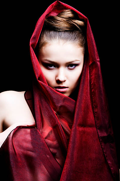 istock beautiful girl enveloped  in red headscarf 98458193