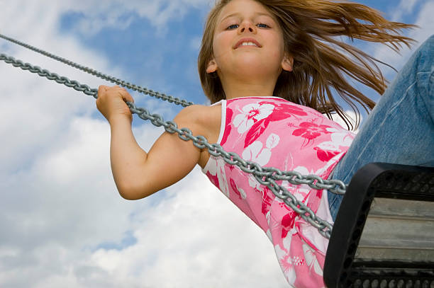 istock Young Girl Swinging 98459266