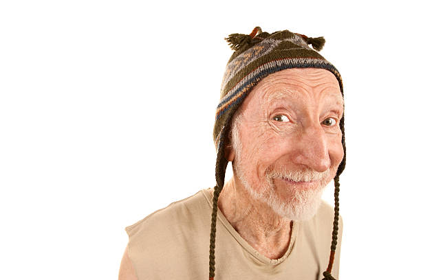 Smiling mature man posing looking at the camera posing outside