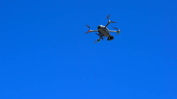 istock Drone taking off against a bright blue summer sky 984603156