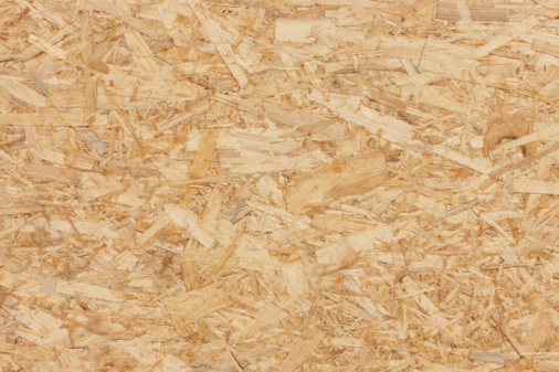 Pressed wood chips board. Wood texture used outdoors.