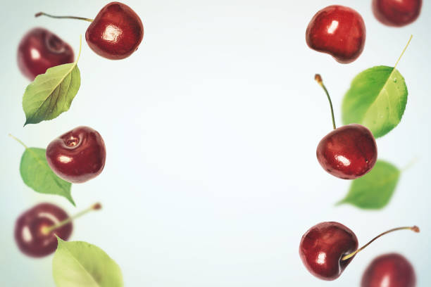 istock Food summer berries background with flying cherries 984610480