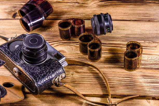 istock Old rangefinder camera and films on wooden table 984614368