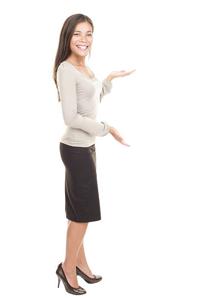 istock Casual businesswoman showing copy space 98461490
