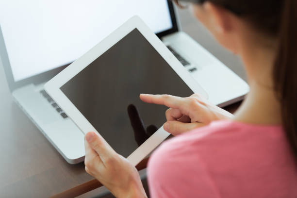 istock Woman using smart tablet in the office 984621658