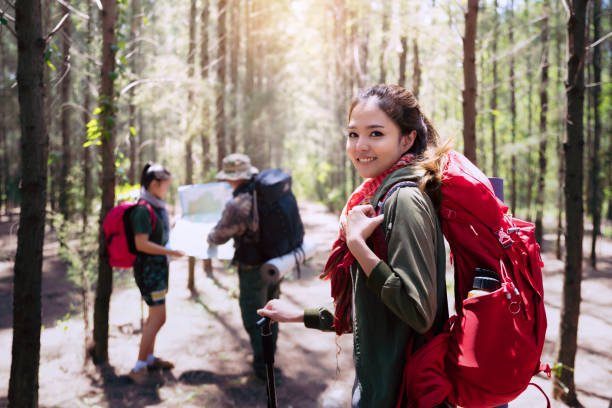 istock People hiking with tent in the forest. 984625482