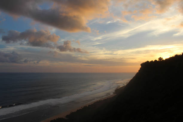 Nyang-nyang beach and some broken shipwrecks during sunset. Taken in Bali, July 2018.
