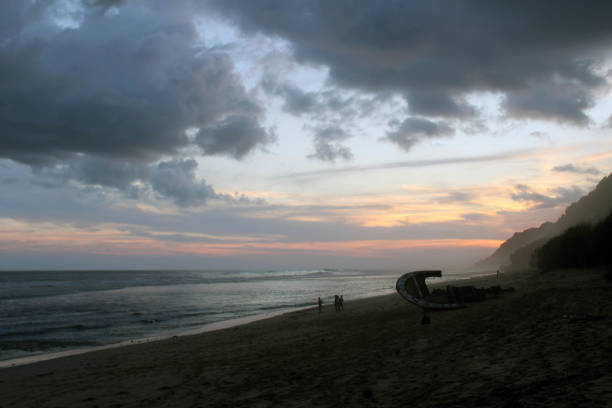 istock Nyang-nyang beach and some broken rustic shipwrecks during cloudy sunset. 984626058