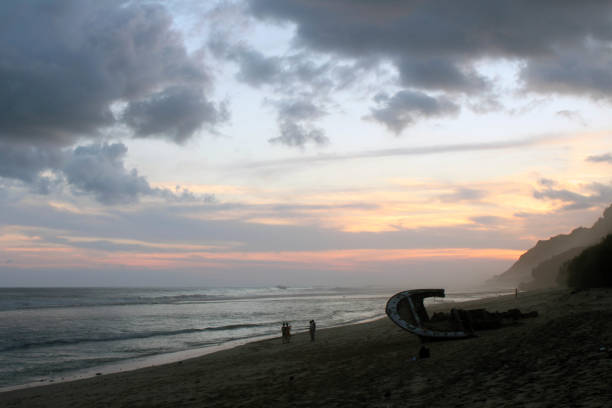Nyang-nyang beach and some broken rustic shipwrecks during cloudy sunset. stock photo