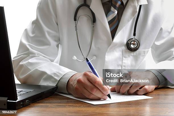 Writing A Prescription Or Medical Examination Notes Stock Photo - Download Image Now