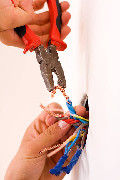 istock Handyman repairing colorful wiring 98462764