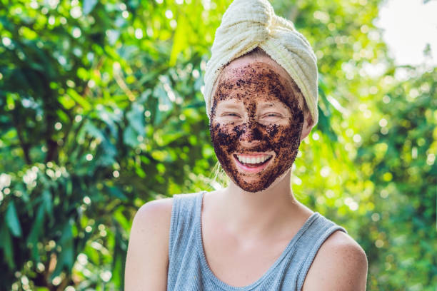 Face Skin Scrub. Portrait Of Sexy Smiling Female Model Applying Natural Coffee Mask, Face Scrub On Facial Skin. Closeup Of Beautiful Happy Woman With Face Covered With Beauty Product. High Resolution Face Skin Scrub. Portrait Of Sexy Smiling Female Model Applying Natural Coffee Mask, Face Scrub On Facial Skin. Closeup Of Beautiful Happy Woman With Face Covered With Beauty Product. High Resolution. vietnamese girls for sale stock pictures, royalty-free photos & images