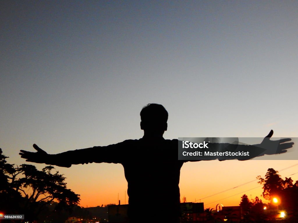 Living the dream A Man in the sunset living the dream Adult Stock Photo