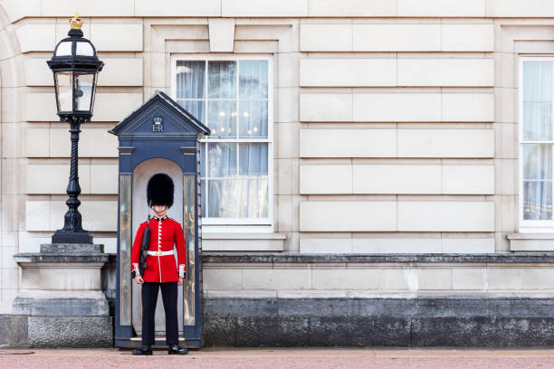 The Queens Guard London: The Coldstream Guard outside Buckingham Palace standing guard early in the day just before the changing of the guards buckingham palace photos stock pictures, royalty-free photos & images