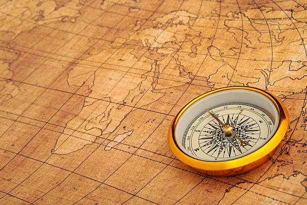 Compass on old map. stock photo