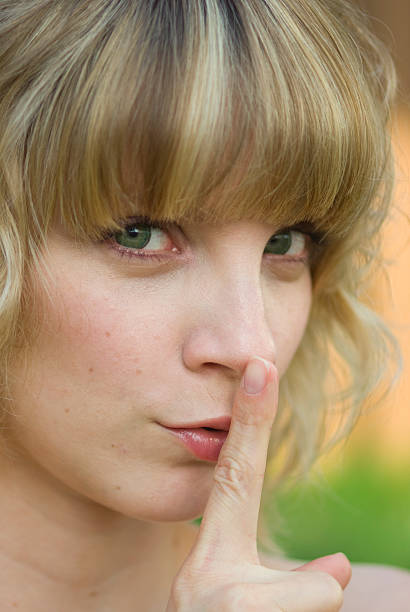 istock Girl with finger on lips 98465114
