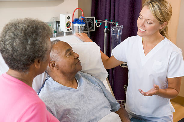 istock Doctor Explaining To Senior Couple 98465215
