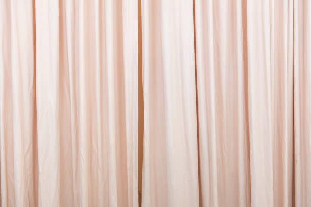 istock red curtain in the comfortable room for background 984653084