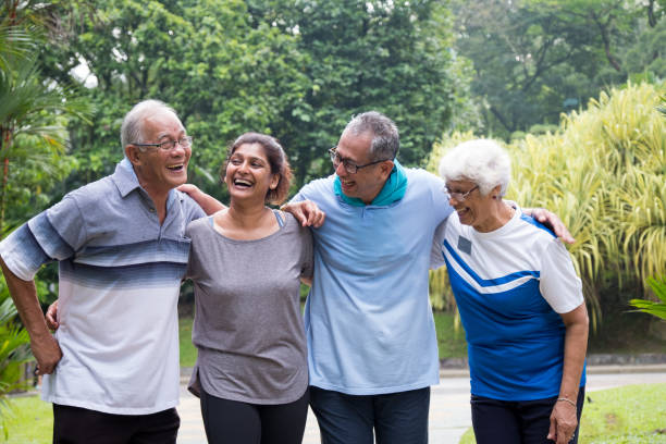 istock Group of happy active seniors in the park 984653578