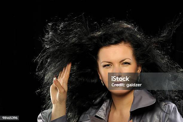 Model With Beautiful Long Hair In Motion Created By Wind Stock Photo - Download Image Now