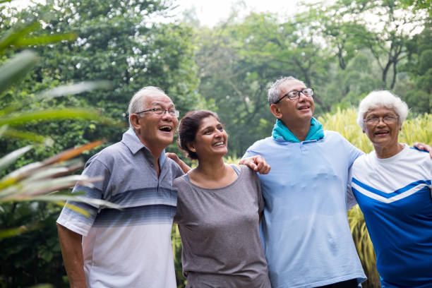 istock Group of happy active seniors in the park 984658302