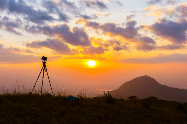 istock silhouette of a tripod at sunset in the mountains. 984659340