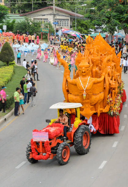 Suphanburi, Thailand - July 12, 2014: Candle festival parade of candle wax procession on The Buddhist Lent Day in Suphanburi, Thailand.