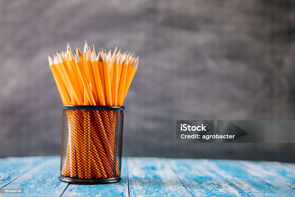 Yellow sharp pencil in black metal basket Pencil Stock Photo