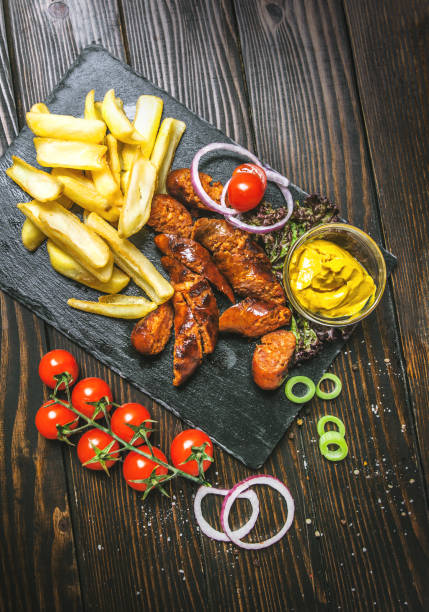 istock Grilled sausages and potatoes 984666764