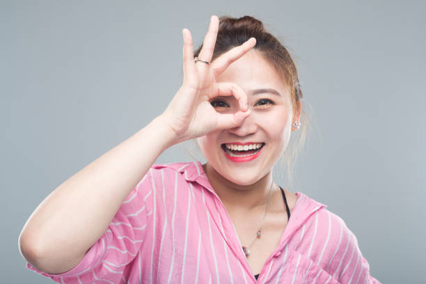 istock studio portrait of cheerful asian woman 984670868