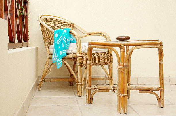 istock Cane chair and table with forgotten neckerchief 98467201