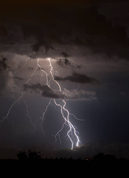 Lighting strike over the Arizona desert at night stock photo