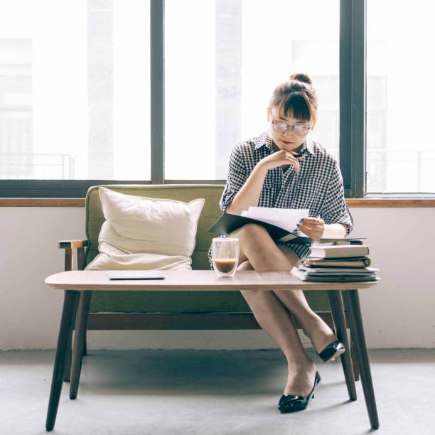 istock young woman working at home office 984675350